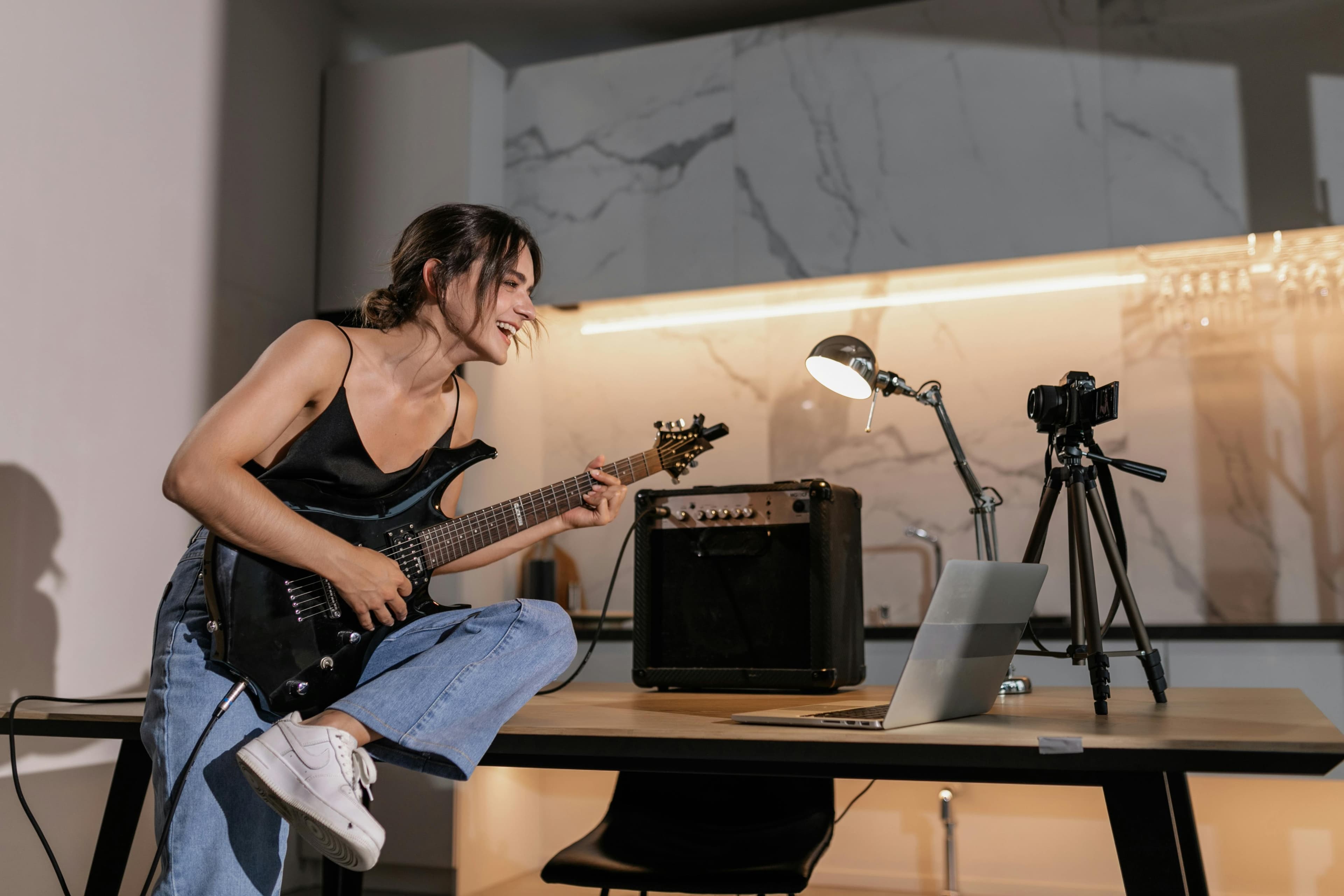 Photograph of someone learning guitar